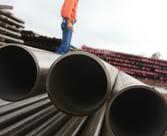 Industrial worker on pipes